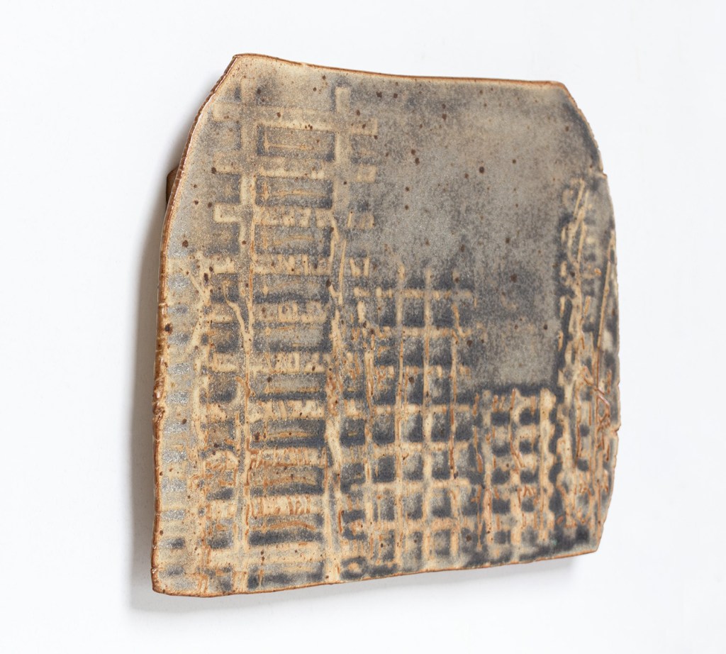 Side view of a wall-mounted ceramic from Scaffolds: Ceramic, 2026, by Matt King. Ceramic.